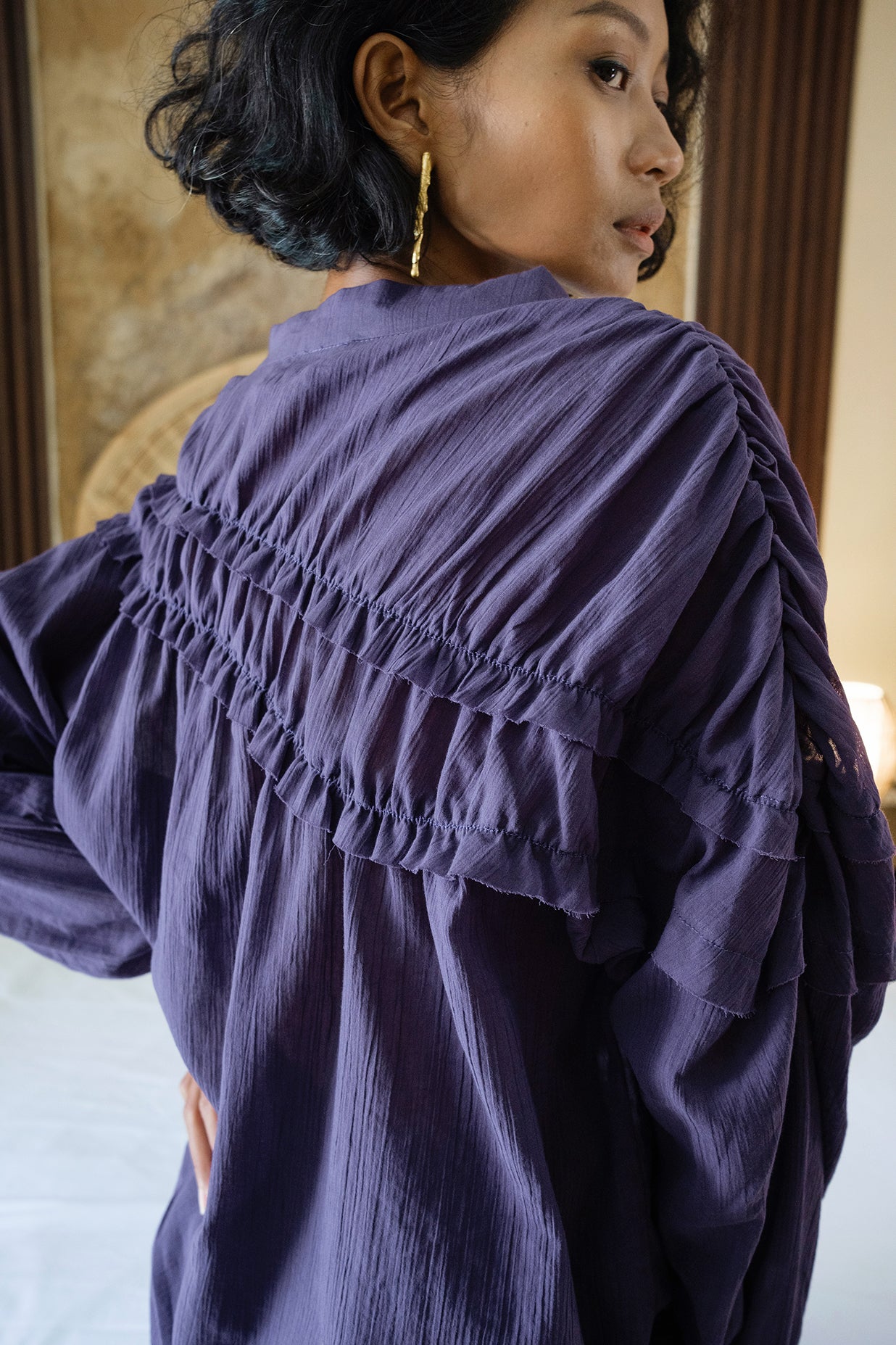 purple ruffle shirt